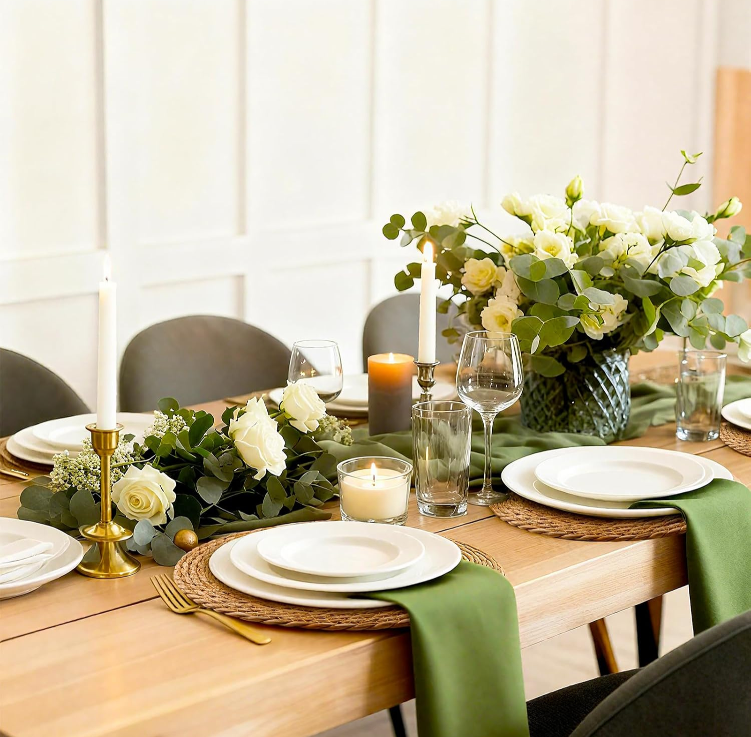 Wedding table set with woven rattan charger placemats, white roses, and candles
